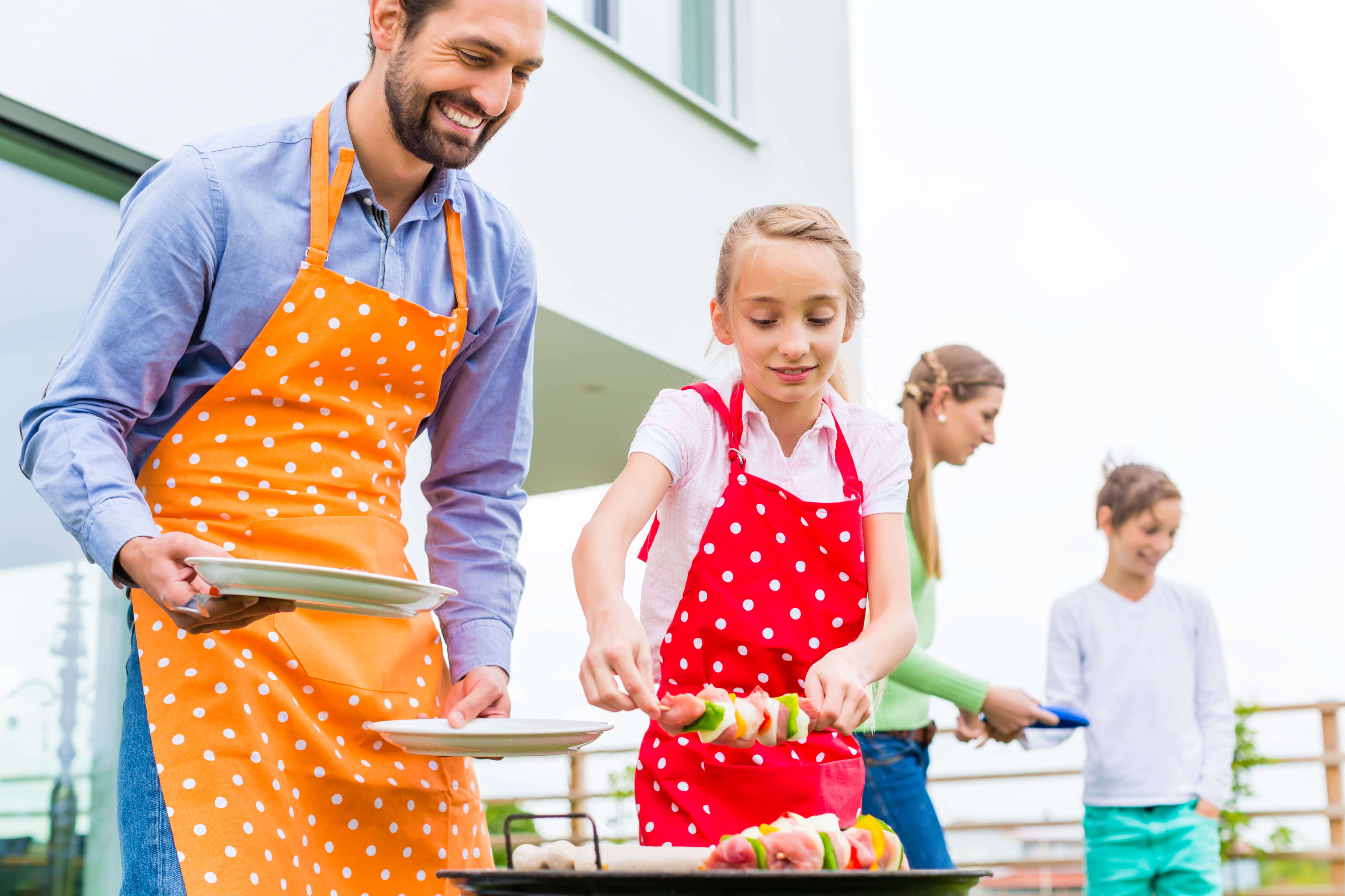 family barbecuing food